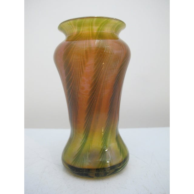 Stunning Bohemian art glass vase with pulled feather design. Green feathering with iridescent tones of pink and gold....