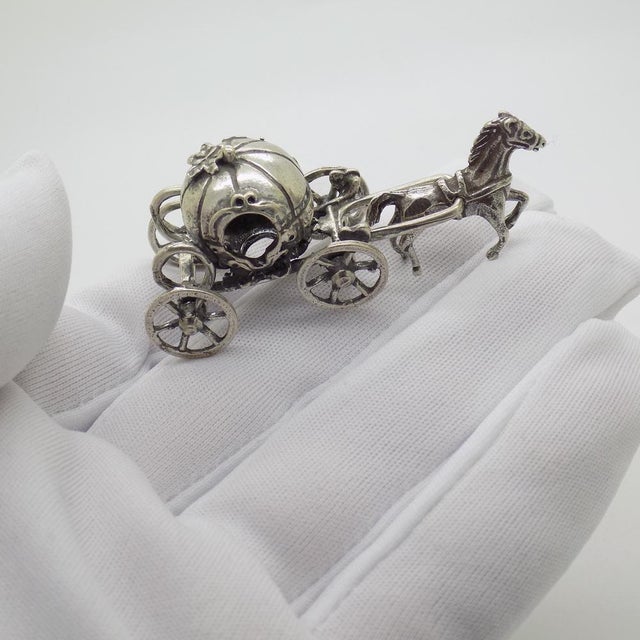 A vintage object depicting a Cinderella-style carriage, handcrafted in Italy between the 1970s and 1980s in authentic...
