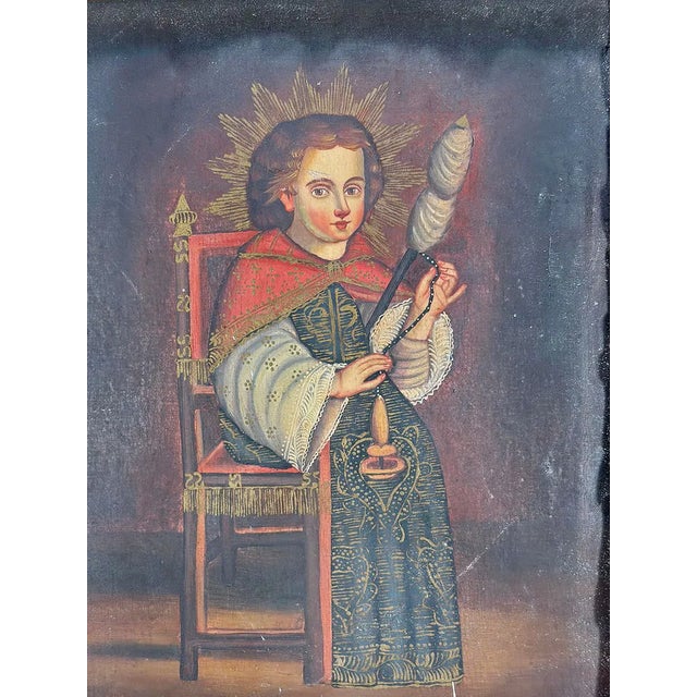 A striking antique Peruvian Colonial School religious portrait, hand-painted on canvas and presented in an elaborate hand-...