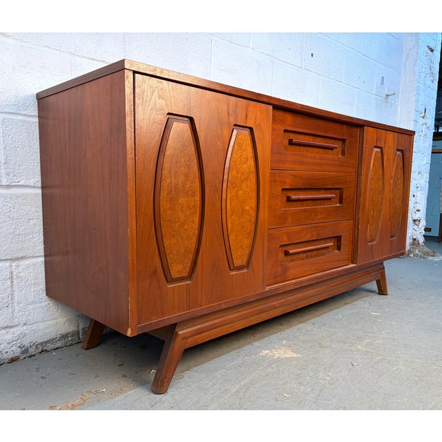 Beautifully crafted Walnut and Burlwood Sliding Door Credenza. This authentic mid-century modern credenza showcases the...