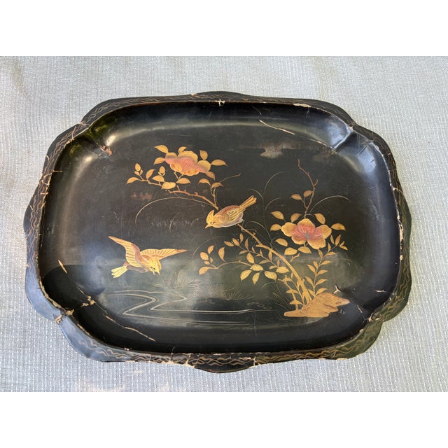 Small vintage black lacquer Chinoiserie bird tray. Softly scalloped rim. Unsigned. Tray has wear, chips, cracks, from age,...