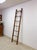 This handsome antique wood and metal library ladder is a functional and characterful vintage find. Seven solid rungs and a...