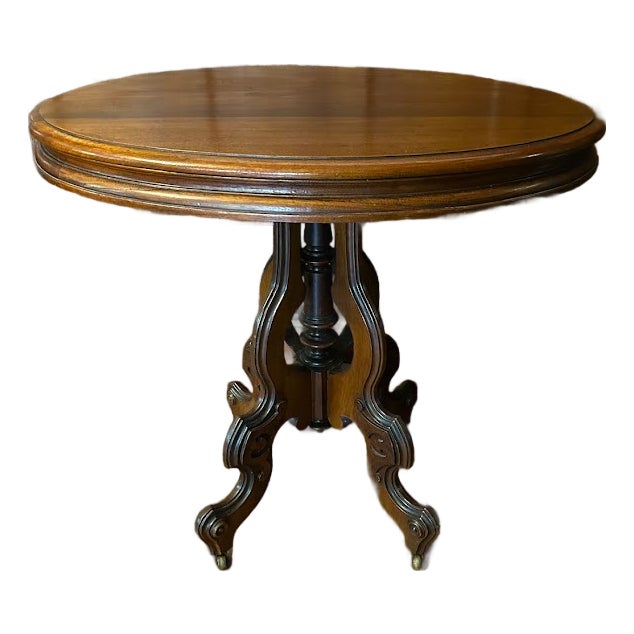Late 19th Century Victorian Rococo Style Carved Walnut Oval Rolling Parlor/Side/Center Table For Sale