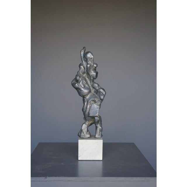 A large and heavy abstract lead sculpture executed by an unknown artist in the 1960s. Its overall impression is of a...