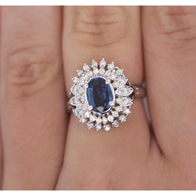 Natural Blue Sapphire & Diamond Platinum Ring. This ring boasts a 1.18-carat blue sapphire center stone. The sapphire is...