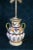 An Italian Majolica vase that has been converted to a dual lamp early on. Antique fixtures and pull chain with white...