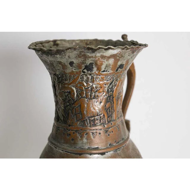 Antique 19th century Middle Eastern tinned copper ewer. A very early Islamic Turkish copper ewer depicting an intricate...