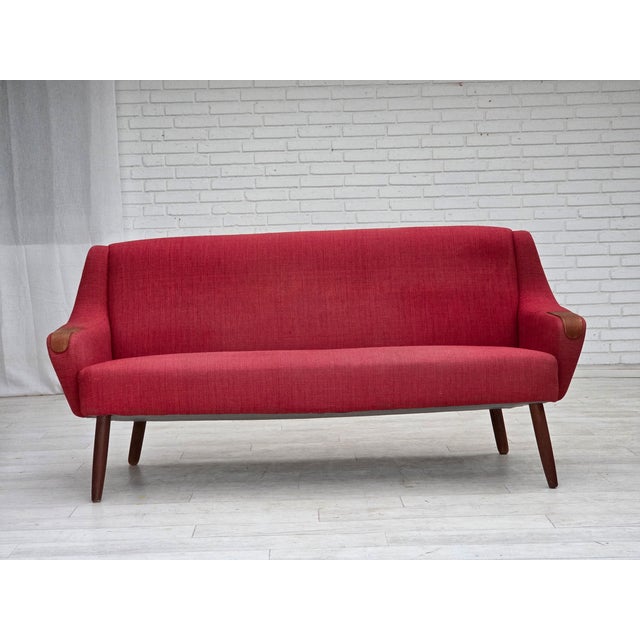 1970s, Danish 2-seater sofa. Red furniture fabric, teak wood legs and armrests. Original good condition: no smells, no...