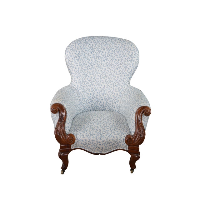 This antique Victorian parlor armchair showcases an exceptional solid walnut show-frame, highlighted by remarkably...