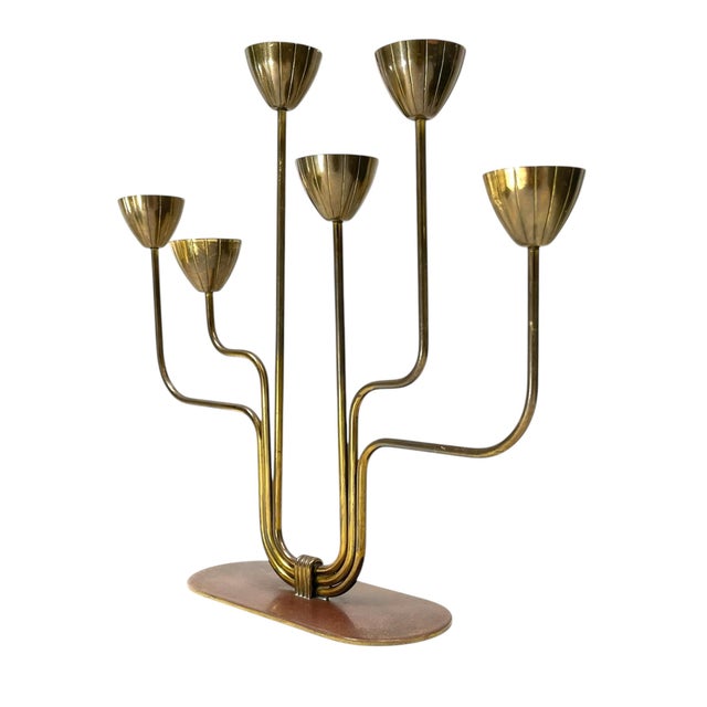 Add some Swedish design to your decor with this iconic quality brass candelabra designed by Gunnar Ander for Ystad Metall...