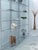 An absolutely stunning, minimalist, and delicate, and very rare interlocking shelf made of chrome-plated steel elements...
