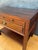Pair of Spanish neoclassical style bedside tables crafted in solid wood, dating to the mid-20th century. Inspired by...