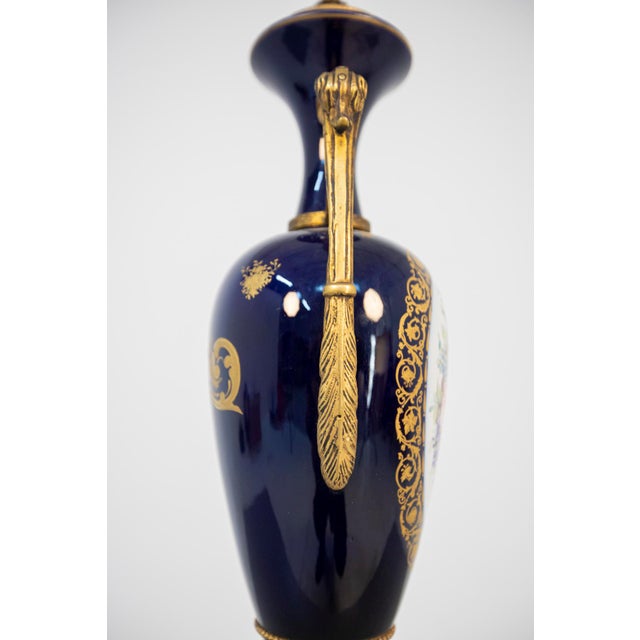 Splendid pair of early 20th century porcelain vases, fine French manufacture. The pair of vases is made entirely of blue...