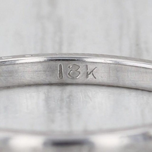 Metal: 18k White Gold Weight: 2.4 Grams Stamps: 18k Rise Above Finger: 1.5 mm Band / Shank Width: 2 mm This ring is a size...