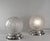 GENET & MICHON A rare pair of French 1925-1930 art deco table lamps in nickel plated solid brass or bronze holding globes...