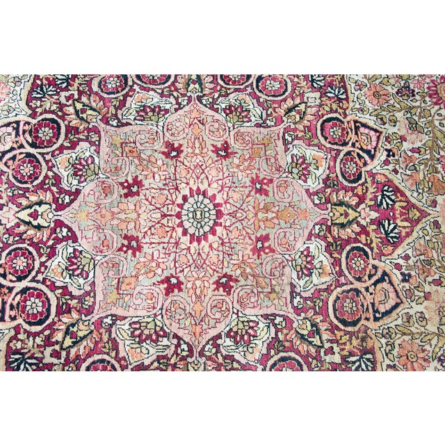 An incredible classic early 20th century Persian Lavar Kirman rug with a mesmerizing central medallion living in a field...
