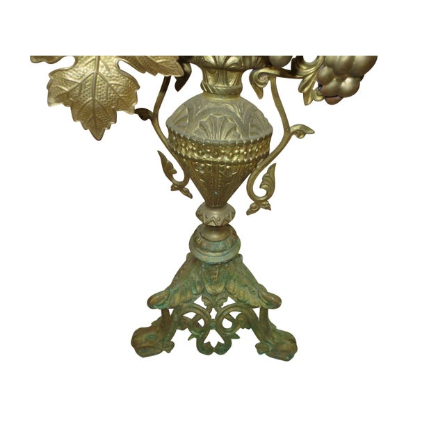 Mid-19th century tall brass floral candleholder.