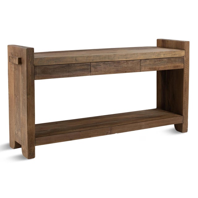 Simple solid salvaged wood rustic console table. Three subtly designed minimalist drawers and bottom shelf for added...
