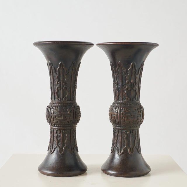 Pair of Agarwood Gu-Form Vases Pair of Chinese wooden vases carved in the shape of a traditional Gu beaker, with a flared...