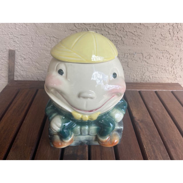 Adorable Humpty Dumpty cookie jar by Brush Pottery of Zanesville, Ohio. Good vintage condition. 2 Minor chips on the edge...