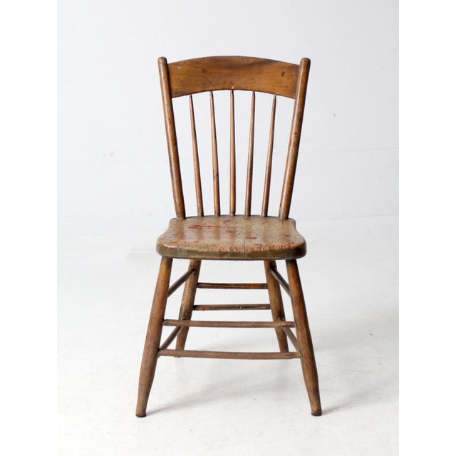 This antique farmhouse chair brings a timeworn charm to dining areas, entryways, or accent corners. The primitive design...