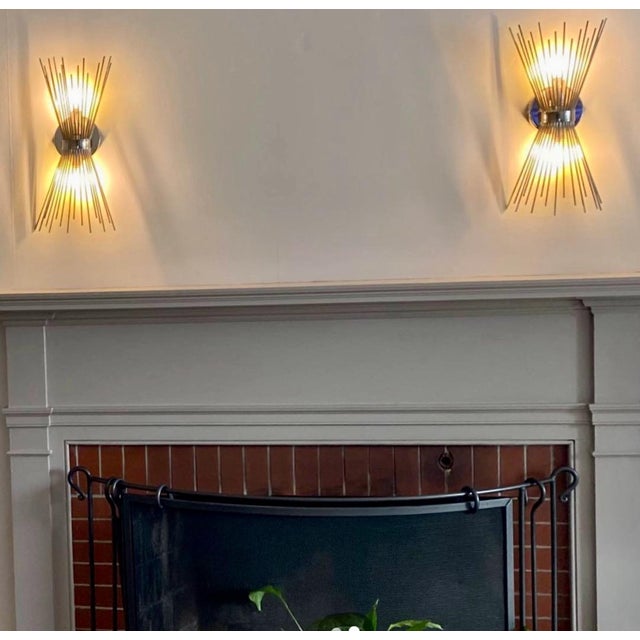 Fill a room with vibrant energy that brings a sense of celebration. These two large wall sconces have a 50s Sputnik style...