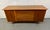 A beautifully crafted Mid-Century Modern walnut credenza by the highly regarded Young Manufacturing Company, showcasing...