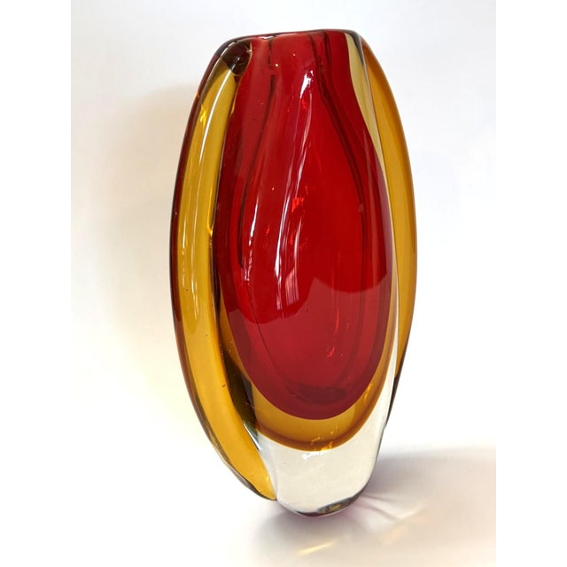 This is a beautifully made glass vase is made in the technique of "Sommerso". It is a glass making method developed in the...