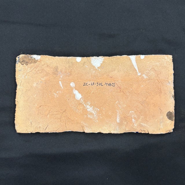 4" x 8" Seville decorative ceramic border featuring a blue and white hand painted design with a crackled glossy finish....