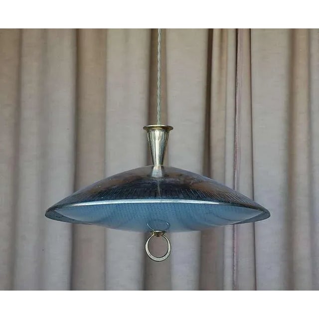 Chic brass and textured glass pendant light. Matching canopy. Extra long cord to adjust drop.
