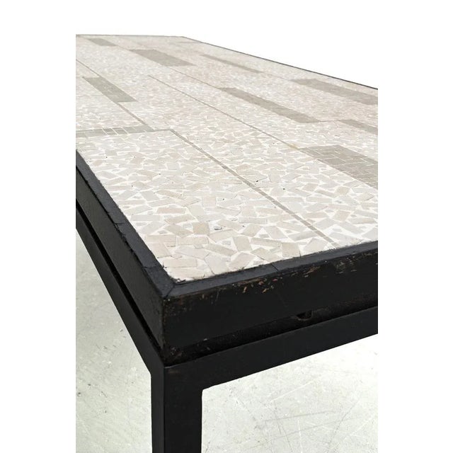 This sturdy and sleek mosaic coffee table has a beautiful pattern. The mosaic is completely handmade. There are traces of...