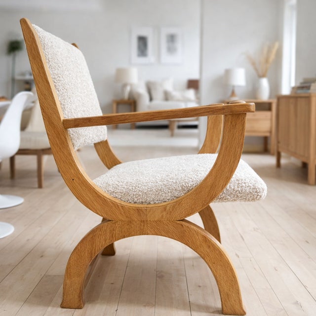 A sculptural Danish armchair showcasing Henning Kjærnulf’s distinctive design language, characterized by bold curves and...