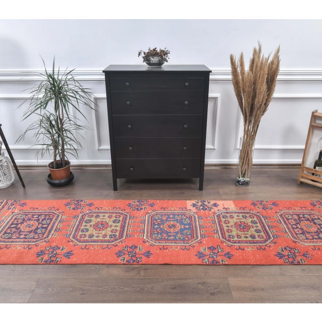 Vintage Turkish Hand-Knotted Floral Runner Rug is a semi-Vintage rug. '80s Eastern region of Turkey's unique rug is...