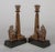 Pair of bronze Egyptian Revival candlesticks with winged sphinx sitting before an obelisk inscribed with hieroglyphics,...