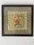 Pair of Chinese silk embroidered gold silk panels with floral and bird motifs. Woven silk borders frame the panels within...