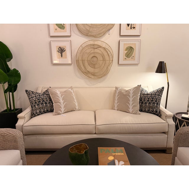 This elegant standard sofa features a refined transitional style that blends classic lines with contemporary simplicity....