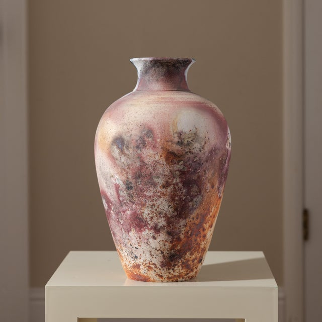Substantial wheel-thrown studio pottery amphora urn vase featuring dramatic saggar and pit firing. Exhibits a burnished...