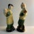 Mid-century pair of Chinoiserie figures of a man and woman holding pottery urns. Charming for display.
