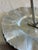 A charming vintage hand wrought aluminum tray, featuring a scalloped hammered edge, embossed floral detailing, and a...