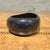 For your consideration, a vintage black acrylic or lucite bangle bracelet, characterized by its thick, chunky design and...