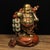 A charming vintage cast bronze sculpture depicting the laughing Buddha, finished with partial gilding and rich red patina....