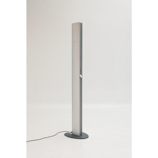Echos floor lamp designed by Jan Van Lierde and produced by Artemide. This metal and plastic model incorporates three...