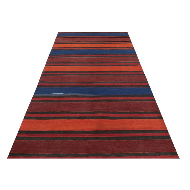 Made with handwoven wool circa 1950-1960, this 5x10 vintage Shahsavan Kilim is a particularly bright and sought-after work...