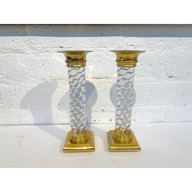A pretty pair of glass or crystal candlesticks with brass or ormolu mounts. The glass or crystal portions are in good...
