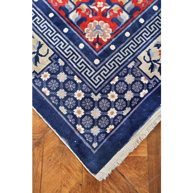 Hand-knotted rug from the 1930s. Strong contrasting colors. Condition: used, very good, suitable for normal use. Wool pile...