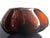 A bold, sculptural crystal vessel, hand-formed with deep folded and pinched edges that catch and refract light...