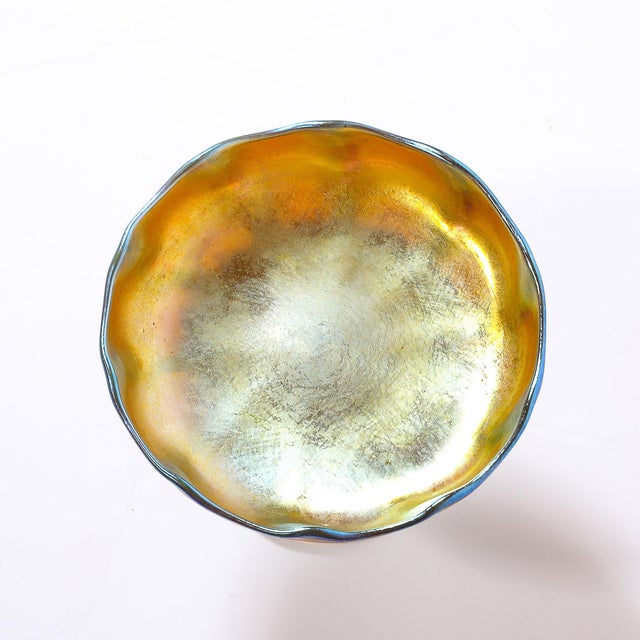 This exquisite Art Nouveau iridescent Favrile glass footed dish, signed L.C. Tiffany & Co., circa 1907, exemplifies the...