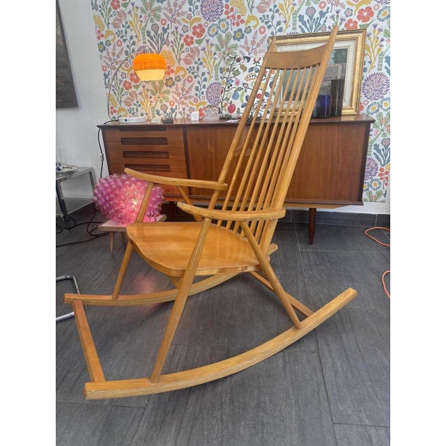 Rocking chair by Varjonen Puunjalostus, 1960s Made of solid wood with elegantly curved lines and an ergonomic design for...