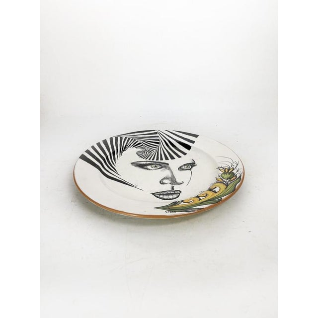 Decorative ceramic plate signed Atelier Ceramic, France, 1980s. A beautiful, handcrafted ceramic piece, hand-painted,...
