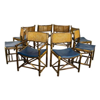 Late 20th Century Campaign Style Set of 8 Dining Chairs by McGuire Rattan Cane & Navy Leather For Sale